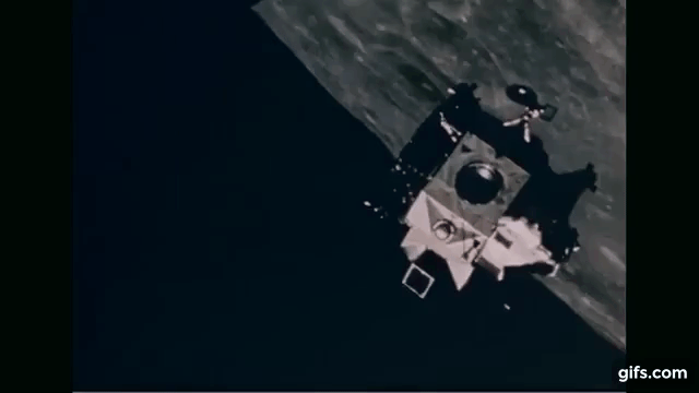 gif of the Eagle lunar landing craft approaching the Columbia with the moon in the background.